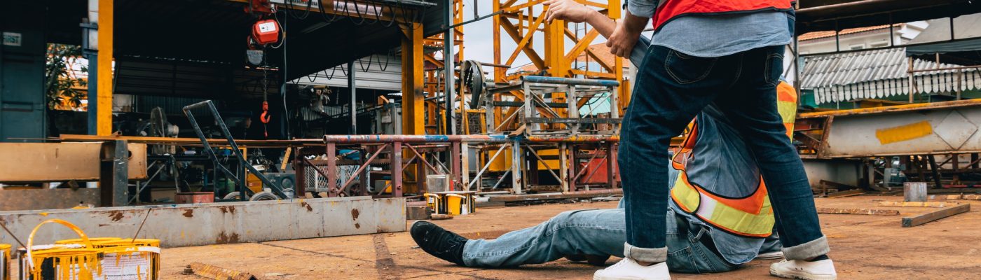 Accident worker injury, man down at construction site, construction worker need medical emergency.