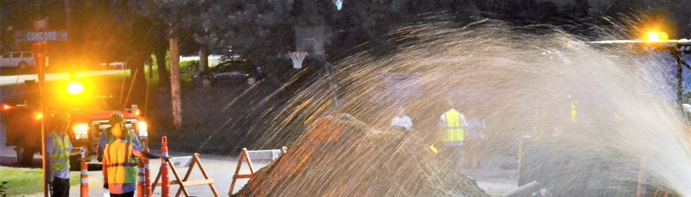 City employees repairing a water leak