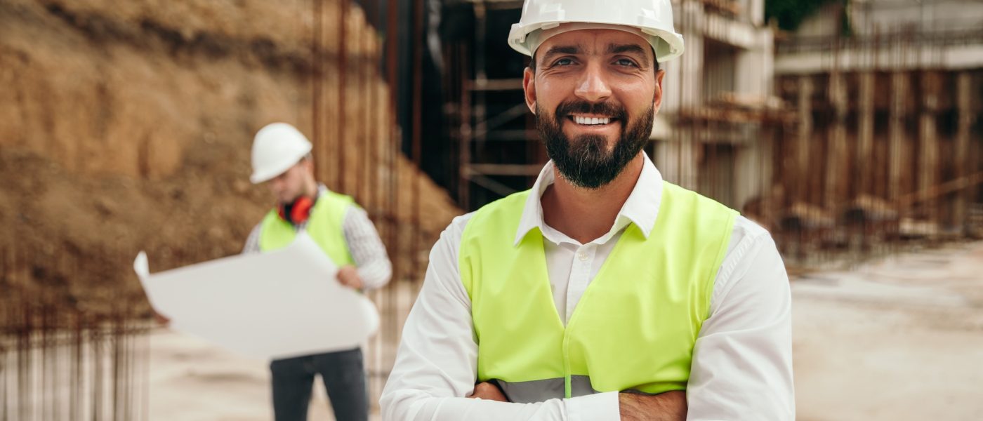 Happy engineer on construction site